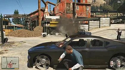 Franklin taking cover beside a car in GTA V story mode